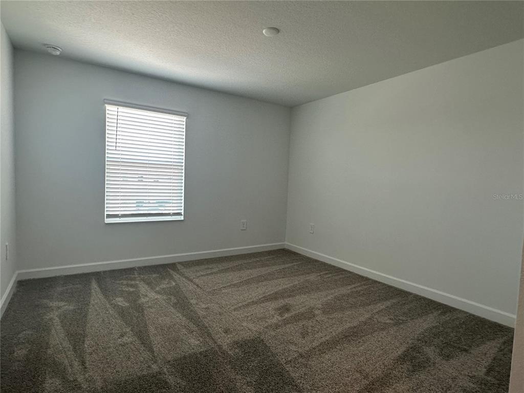 3128 Addison Boulevard St. Cloud, FL 34771 - Photo 20 of 35 an empty room with a window