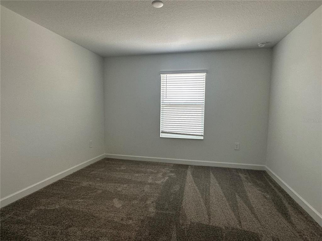3128 Addison Boulevard St. Cloud, FL 34771 - Photo 21 of 35 an empty room with a window