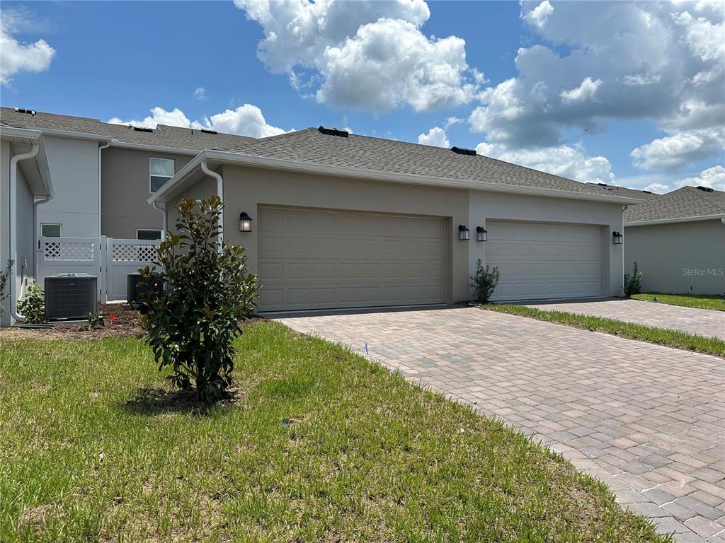 3128 Addison Boulevard St. Cloud, FL 34771 - Photo 26 of 35 a house view with a garden space