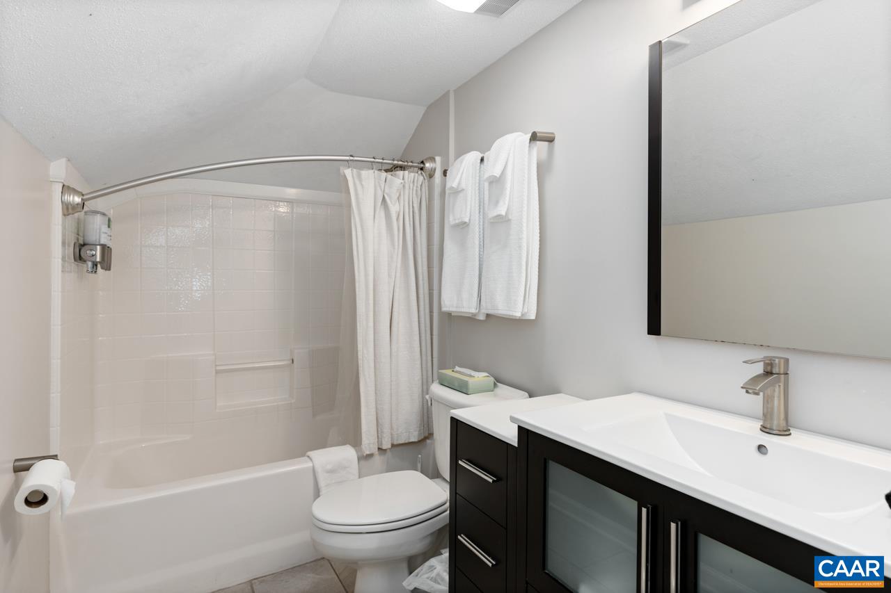 2078 Stone Ridge Roseland, VA 22967 - Photo 30 of 39 a bathroom with a sink toilet and shower