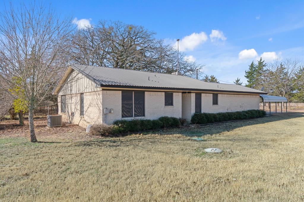 276 Point Tx 75472 Point, TX 75472 - Photo 13 of 18 a view of a yard in front of a house with large trees