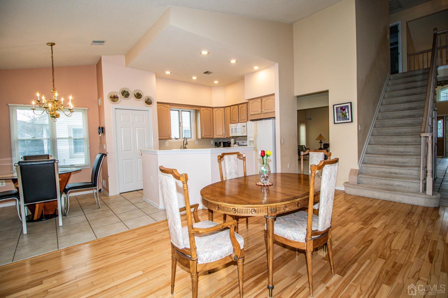 32 Harwood Road Monroe Township, NJ 08831 - Photo 14 of 34 a dining room with furniture and wooden floor