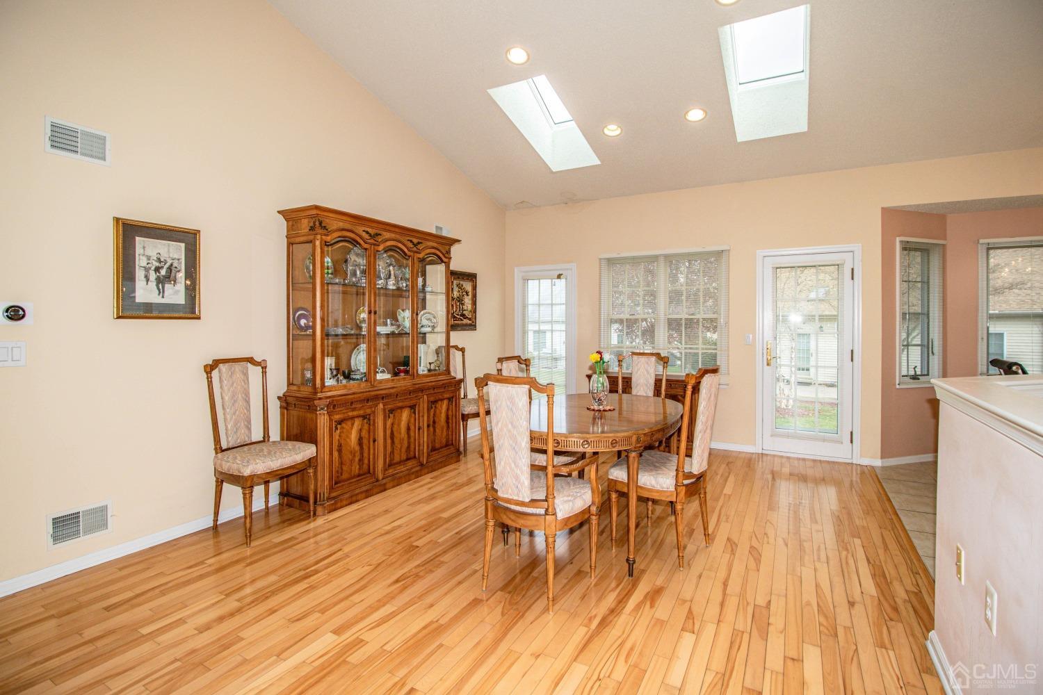32 Harwood Road Monroe Township, NJ 08831 - Photo 15 of 34 a dining room with furniture and wooden floor