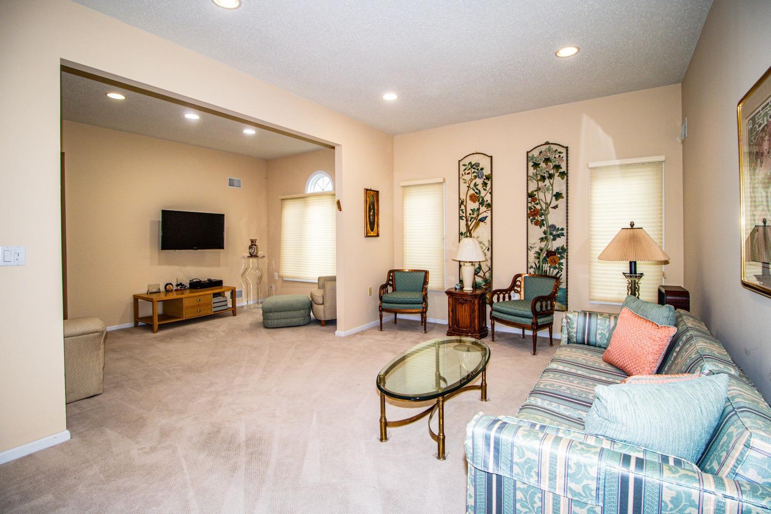 32 Harwood Road Monroe Township, NJ 08831 - Photo 17 of 34 a living room with furniture and a flat screen tv