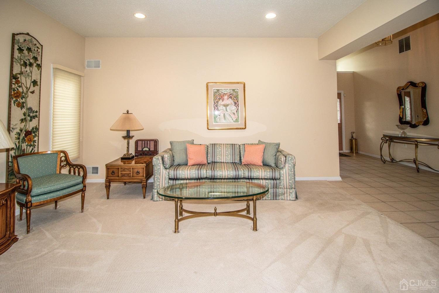 32 Harwood Road Monroe Township, NJ 08831 - Photo 18 of 34 a living room with furniture and a table