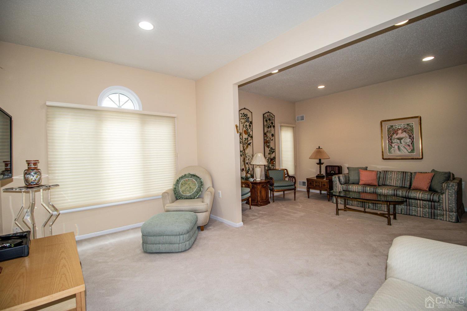 32 Harwood Road Monroe Township, NJ 08831 - Photo 19 of 34 a living room with furniture and a large window