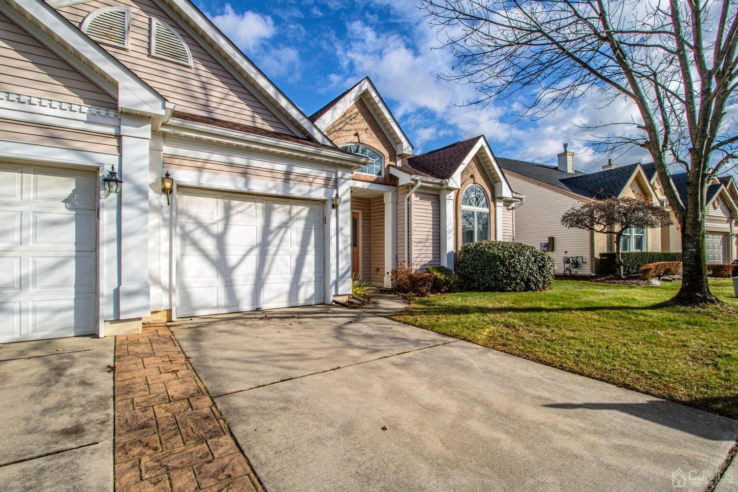 32 Harwood Road Monroe Township, NJ 08831 - Photo 2 of 34 a front view of a house with a yard