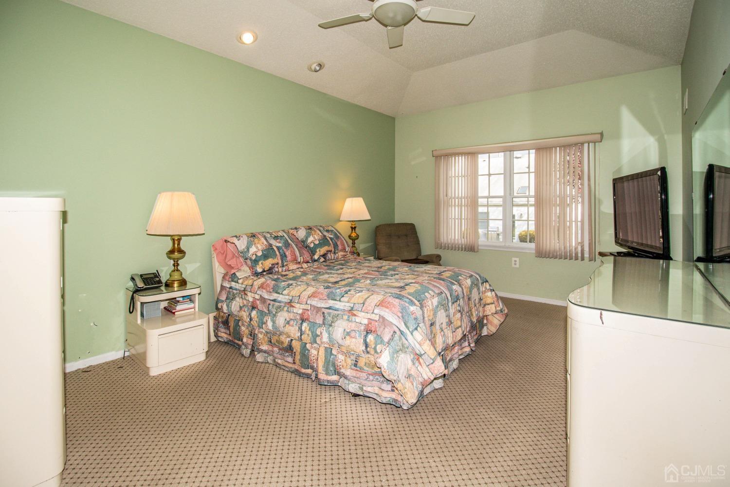32 Harwood Road Monroe Township, NJ 08831 - Photo 24 of 34 a bedroom with a bed and a television