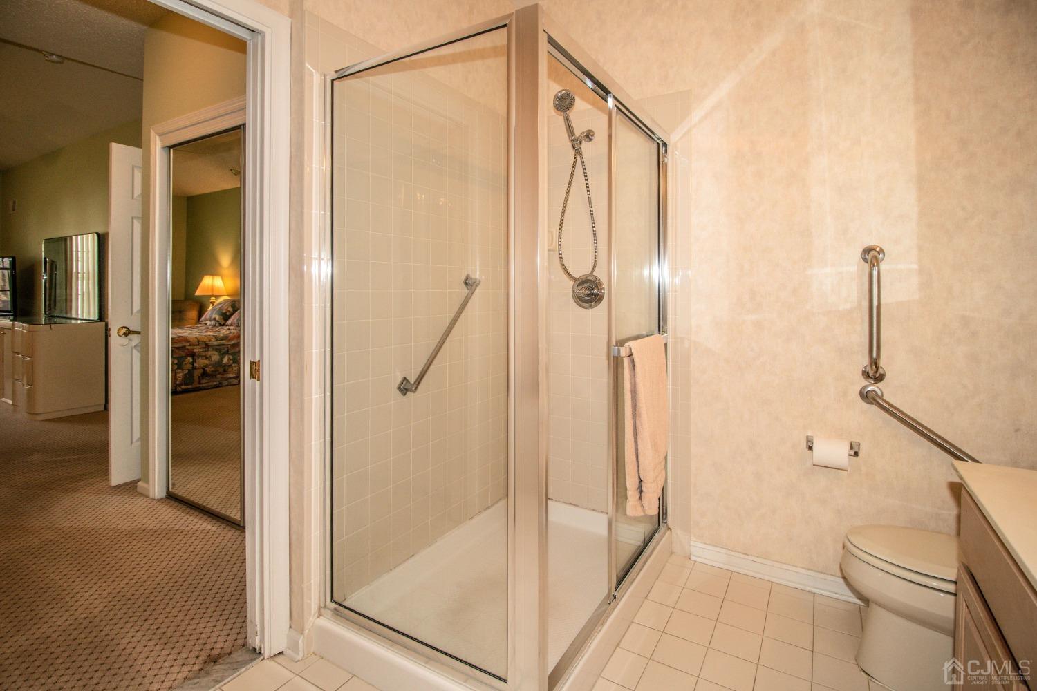 32 Harwood Road Monroe Township, NJ 08831 - Photo 28 of 34 a bathroom with a glass shower door