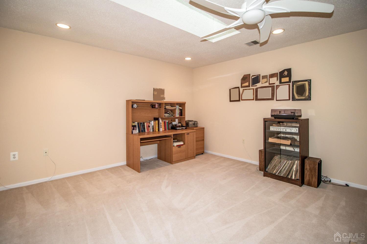 32 Harwood Road Monroe Township, NJ 08831 - Photo 30 of 34 a view of a livingroom with a cabinet