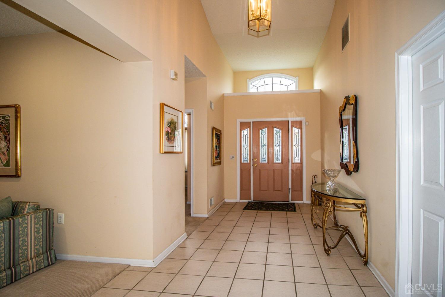 32 Harwood Road Monroe Township, NJ 08831 - Photo 4 of 34 a view of a hallway with windows