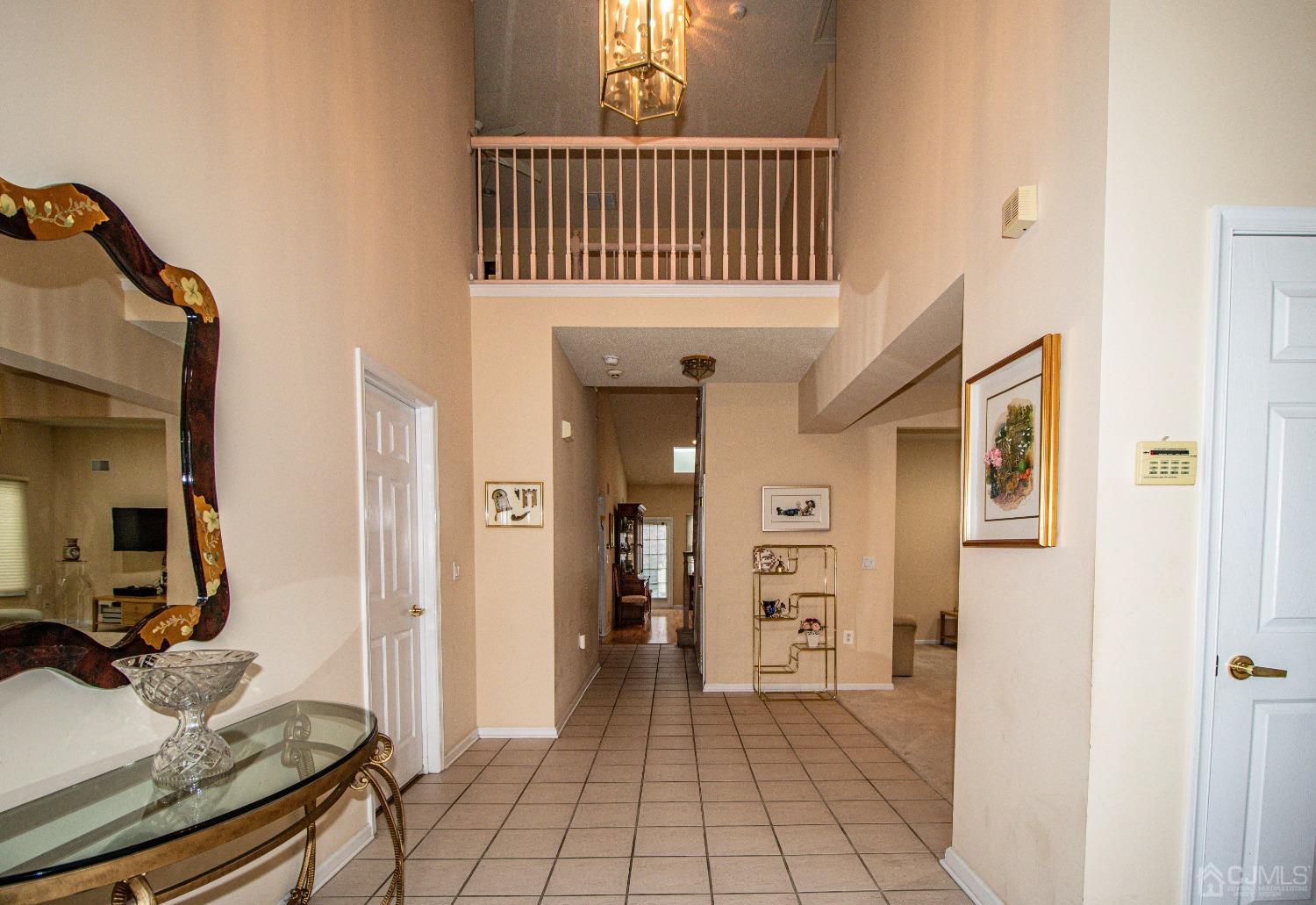 32 Harwood Road Monroe Township, NJ 08831 - Photo 6 of 34 a view of a hallway to a livingroom with furniture