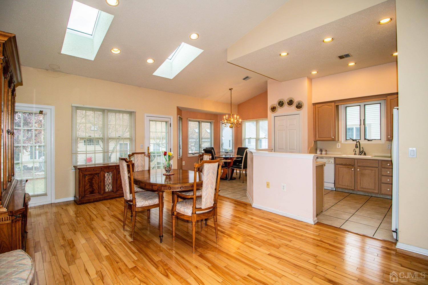 32 Harwood Road Monroe Township, NJ 08831 - Photo 7 of 34 a view of a dining room with furniture window and wooden floor