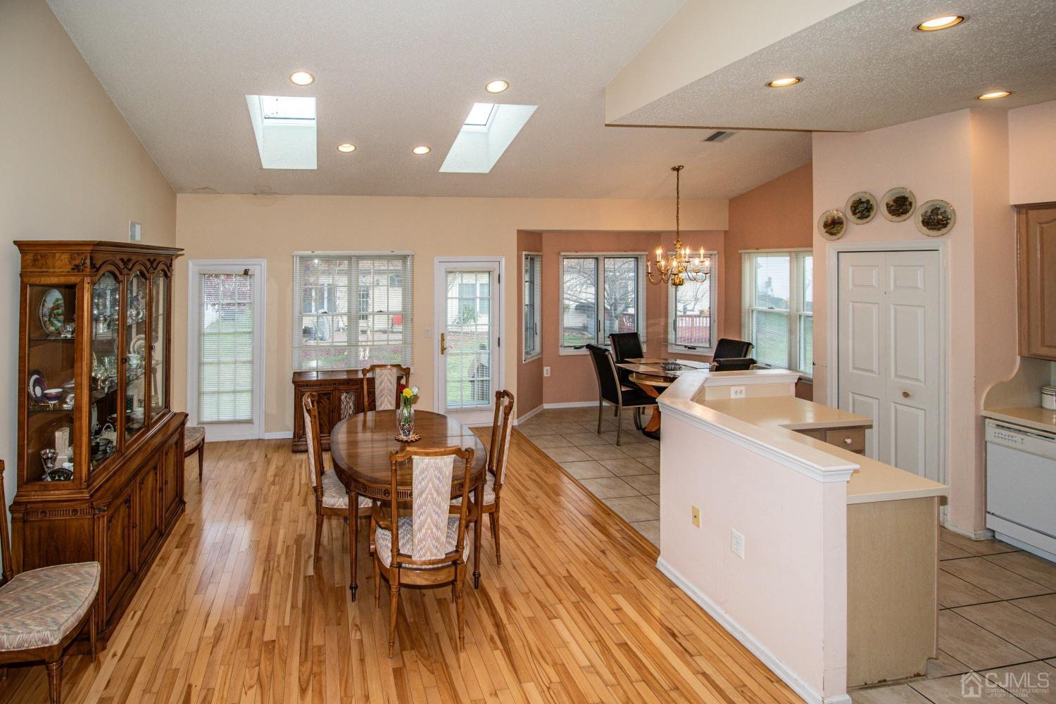 32 Harwood Road Monroe Township, NJ 08831 - Photo 8 of 34 a view of a dining room with furniture and wooden floor
