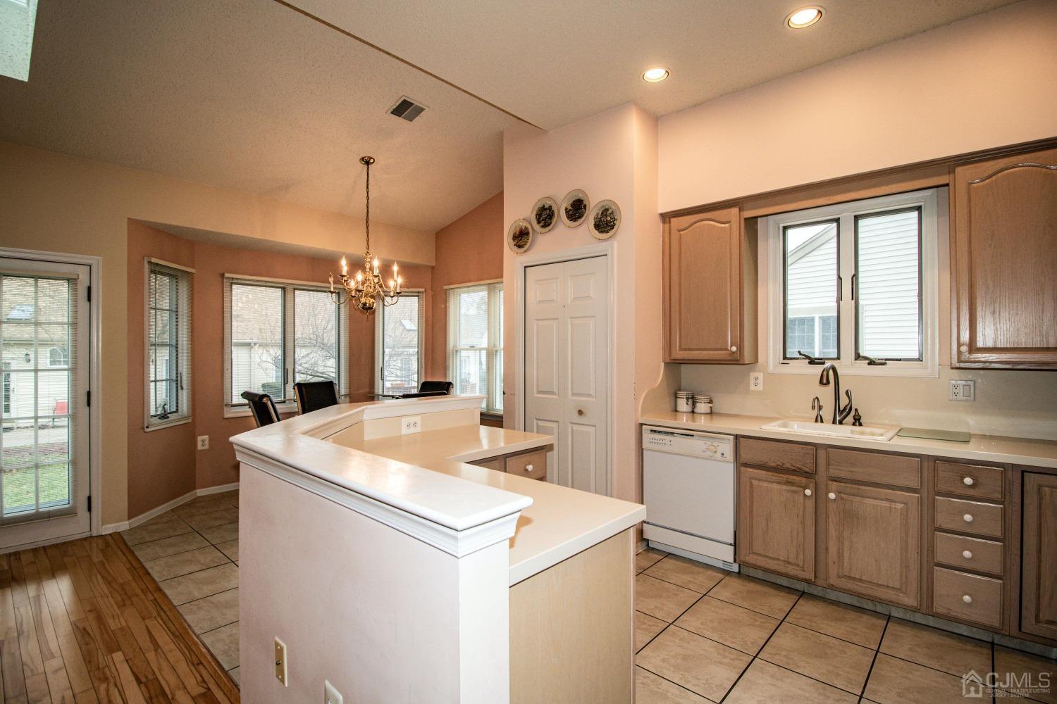 32 Harwood Road Monroe Township, NJ 08831 - Photo 9 of 34 a kitchen with sink stove and refrigerator