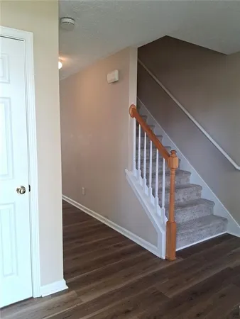 a view of entryway with wooden floor