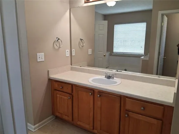 a white bath tub sitting next to a window