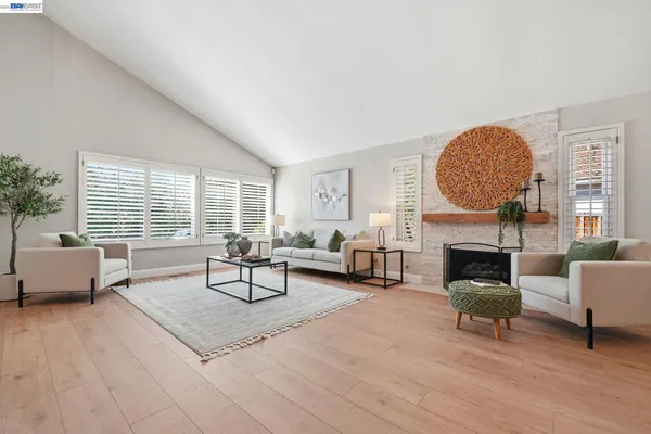 a dining room with furniture and window