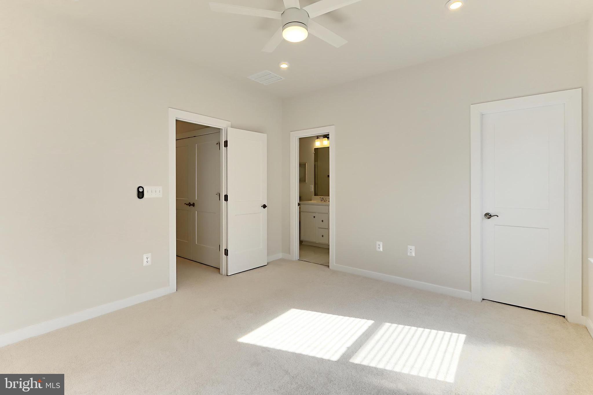 14176 Gypsum Loop Chantilly, VA 20151 - Photo 30 of 43 an empty room with closet area