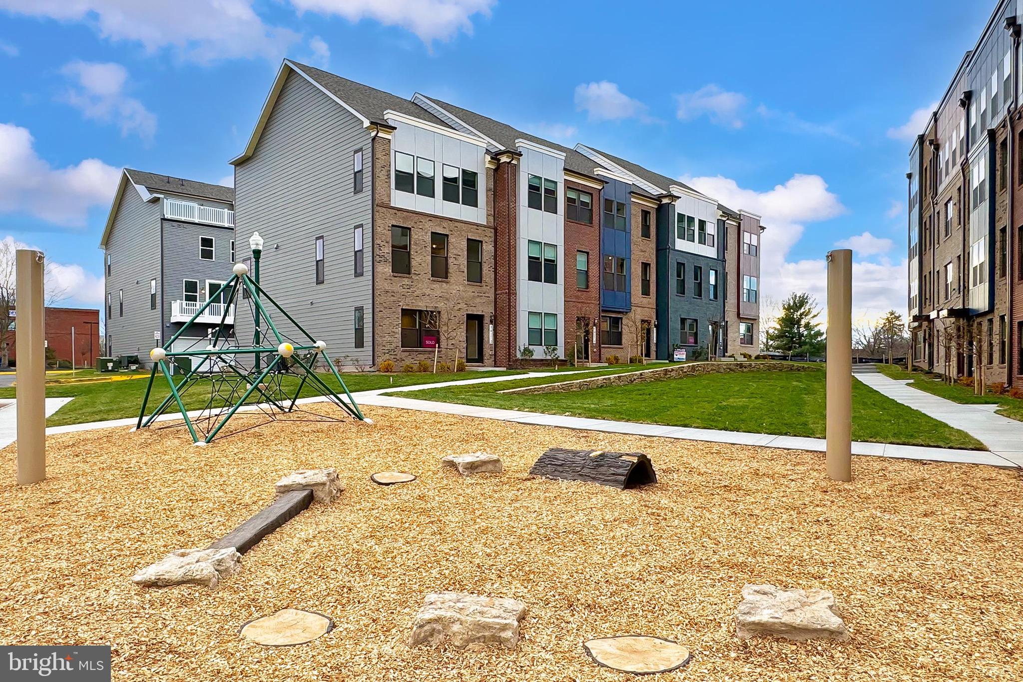 14176 Gypsum Loop Chantilly, VA 20151 - Photo 41 of 43 a view of a building with a swimming pool
