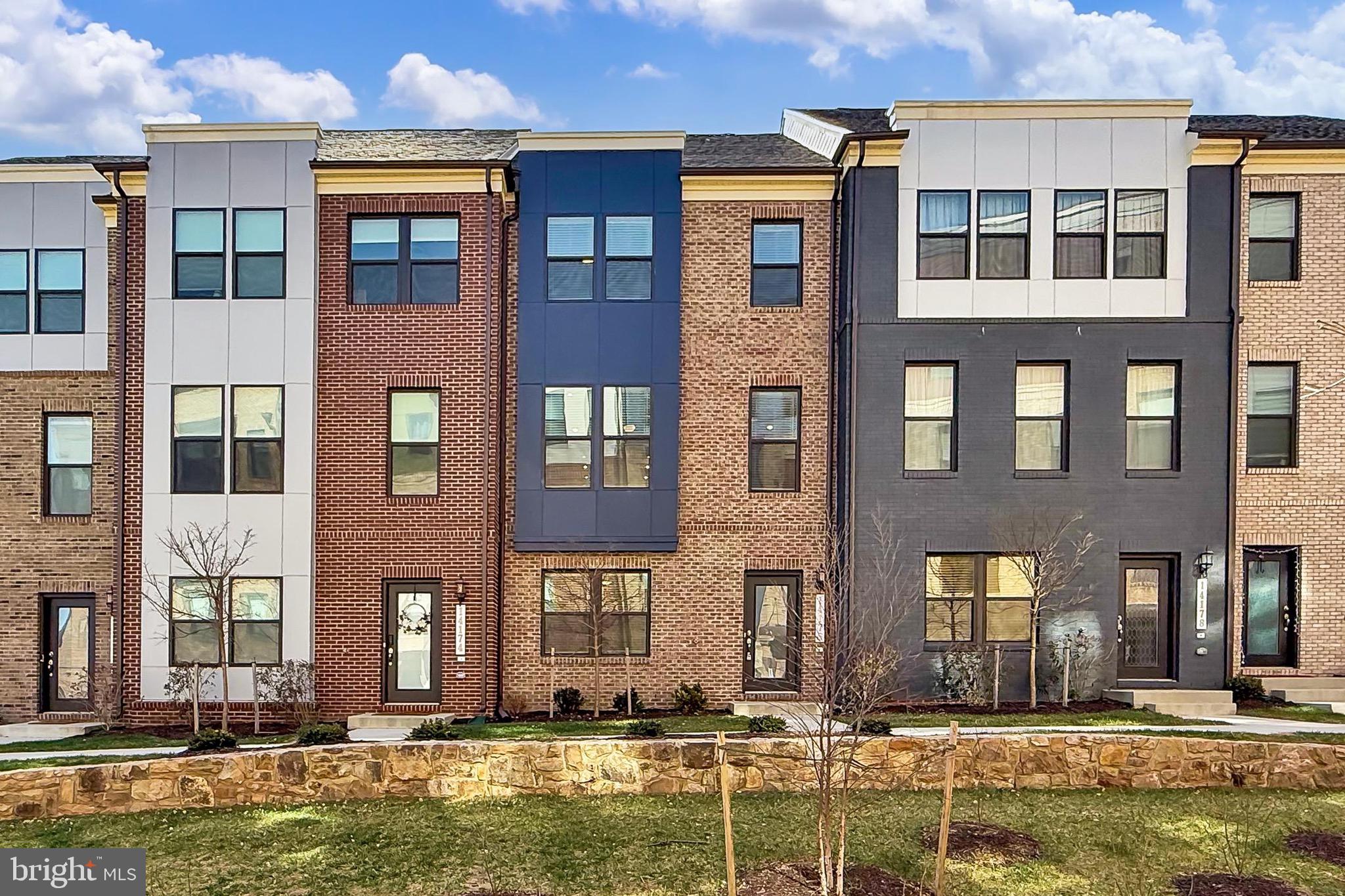 14176 Gypsum Loop Chantilly, VA 20151 - Photo 42 of 43 a front view of a building with a swimming pool