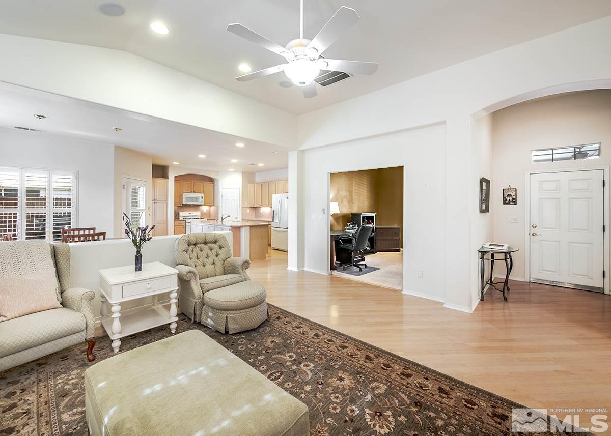 1408 Wild Wolf Way Reno, NV 89521 - Photo 4 of 24 a living room with furniture and a wooden floor
