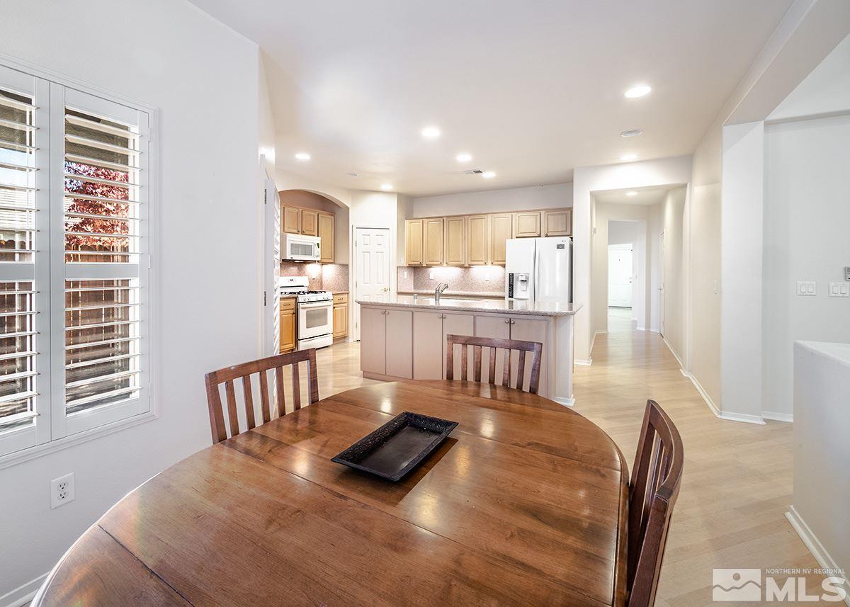 1408 Wild Wolf Way Reno, NV 89521 - Photo 5 of 24 a living room with furniture and a table