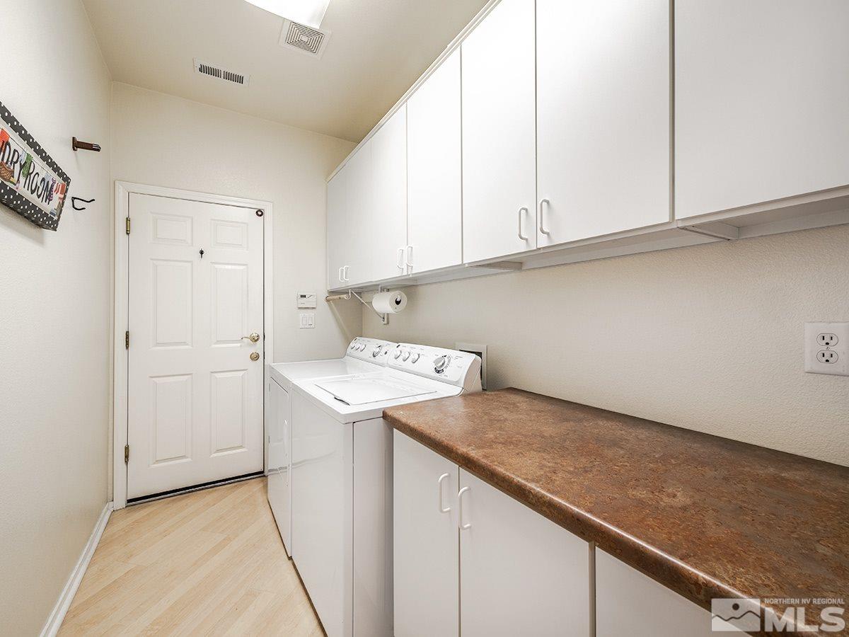 1408 Wild Wolf Way Reno, NV 89521 - Photo 9 of 24 a utility room with washer and dryer
