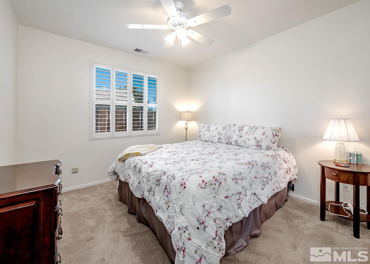 1408 Wild Wolf Way Reno, NV 89521 - Photo 10 of 24 a bedroom with bed and window