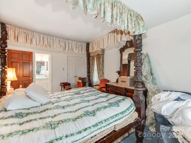 a bathroom with a sink mirror toilet and shower