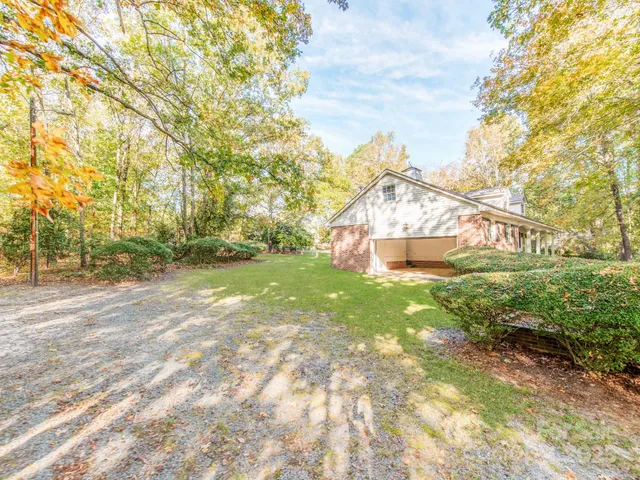 a view of outdoor space with deck and yard