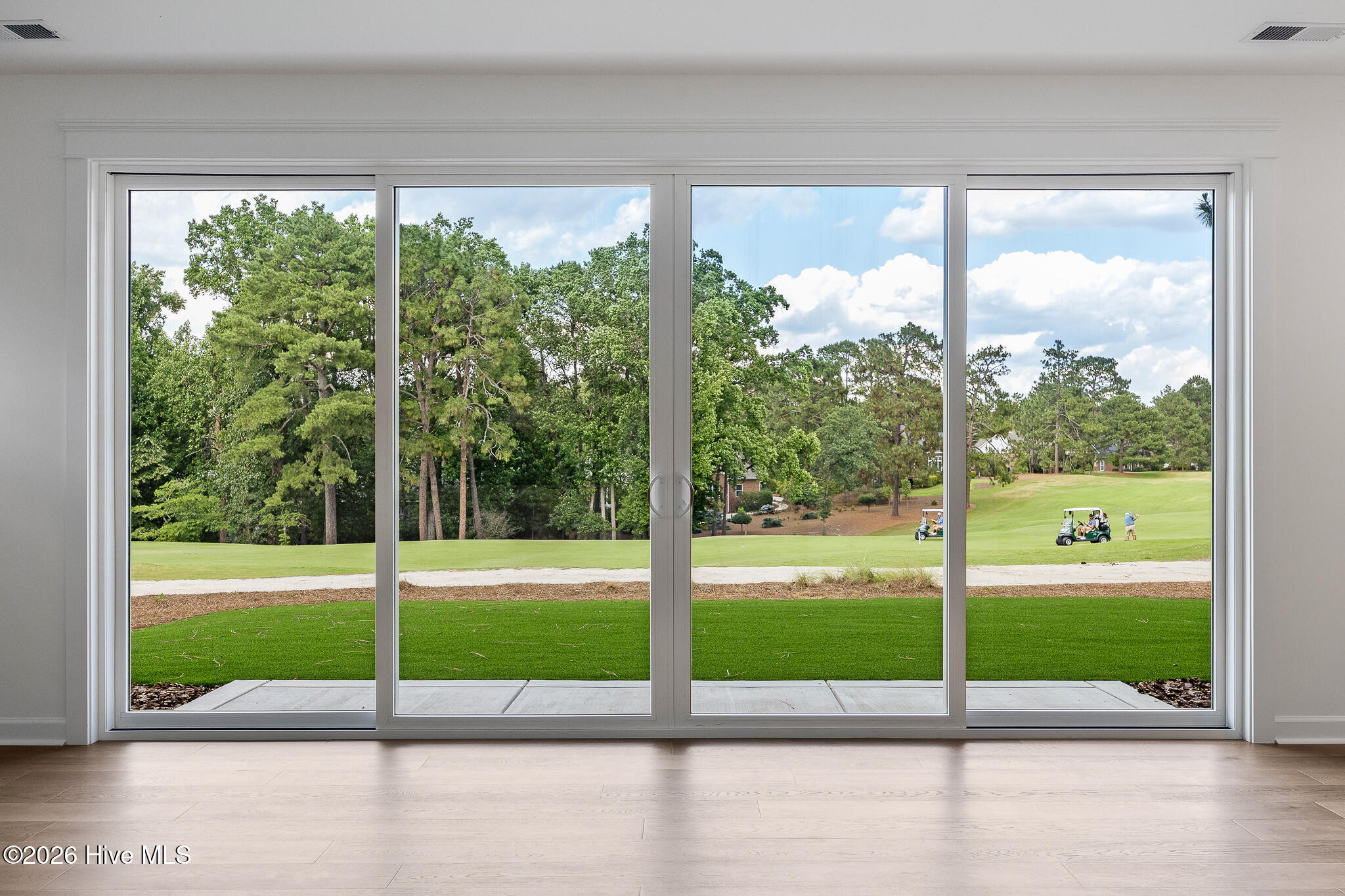 2 Innisbrook Place Pinehurst, NC 28374 - Photo 13 of 53 Quad Slider from Living Room to Backyard