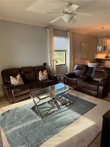 a living room with furniture rug and window