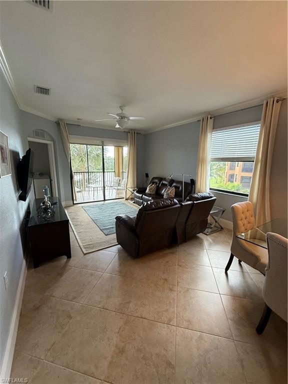 9719 Acqua Court, Unit 238 Naples, FL 34113 - Photo 13 of 25 a living room with furniture and a large window
