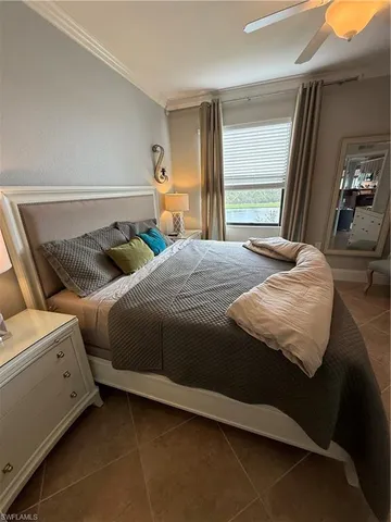 a bedroom with bed and window