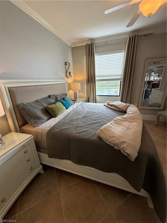 9719 Acqua Court, Unit 238 Naples, FL 34113 - Photo 20 of 25 a bedroom with bed and window