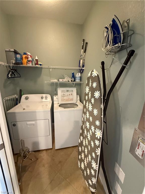 9719 Acqua Court, Unit 238 Naples, FL 34113 - Photo 25 of 25 a utility room with dryer and washer