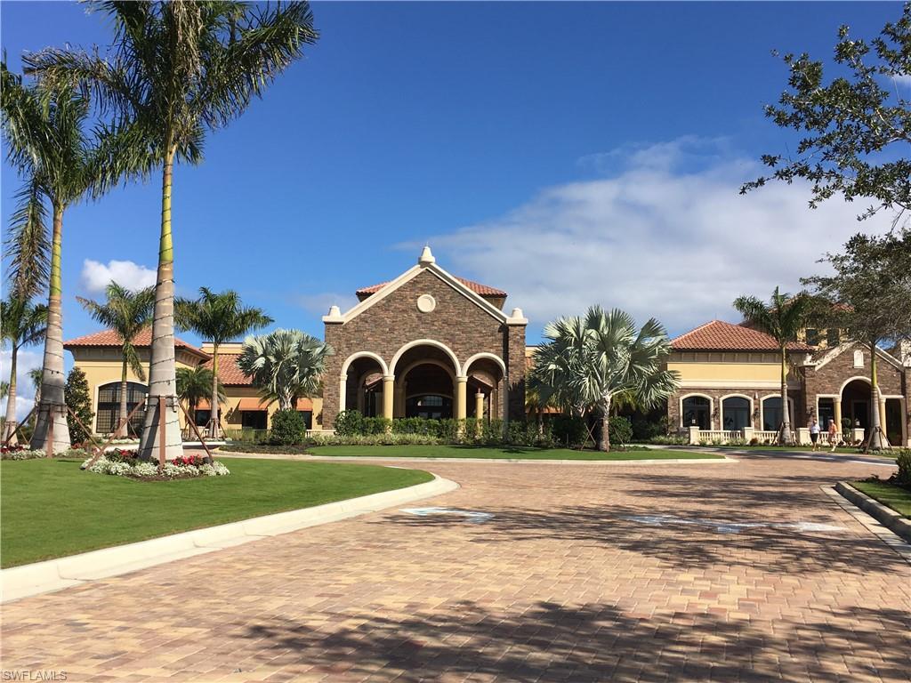 9719 Acqua Court, Unit 238 Naples, FL 34113 - Photo 7 of 25 a front view of a house with a yard