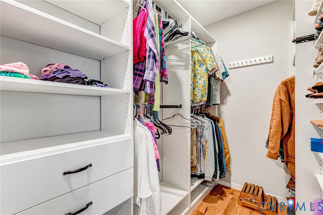 7401 Leaf Fall Way Mechanicsville, VA 23111 - Photo 25 of 48 a view of walk in closet with clothes and shoes