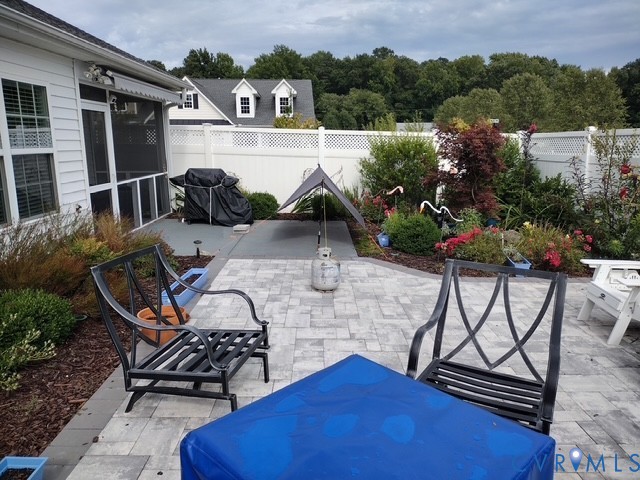 7401 Leaf Fall Way Mechanicsville, VA 23111 - Photo 37 of 48 a view of a chairs and table in the patio