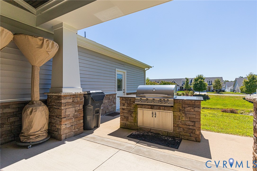 7401 Leaf Fall Way Mechanicsville, VA 23111 - Photo 45 of 48 a view of a patio with couches chairs and a stove