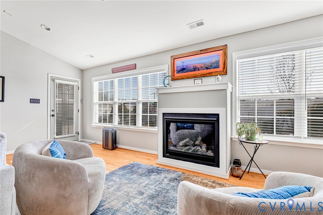 7401 Leaf Fall Way Mechanicsville, VA 23111 - Photo 9 of 48 a living room with furniture and a fireplace