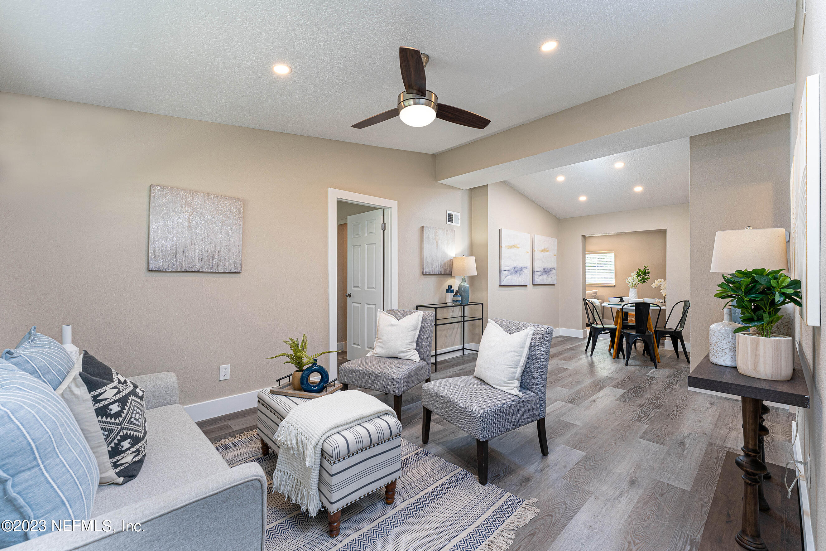 939 Westgate Drive Jacksonville, FL 32221 - Photo 2 of 31 a living room with furniture and potted plant