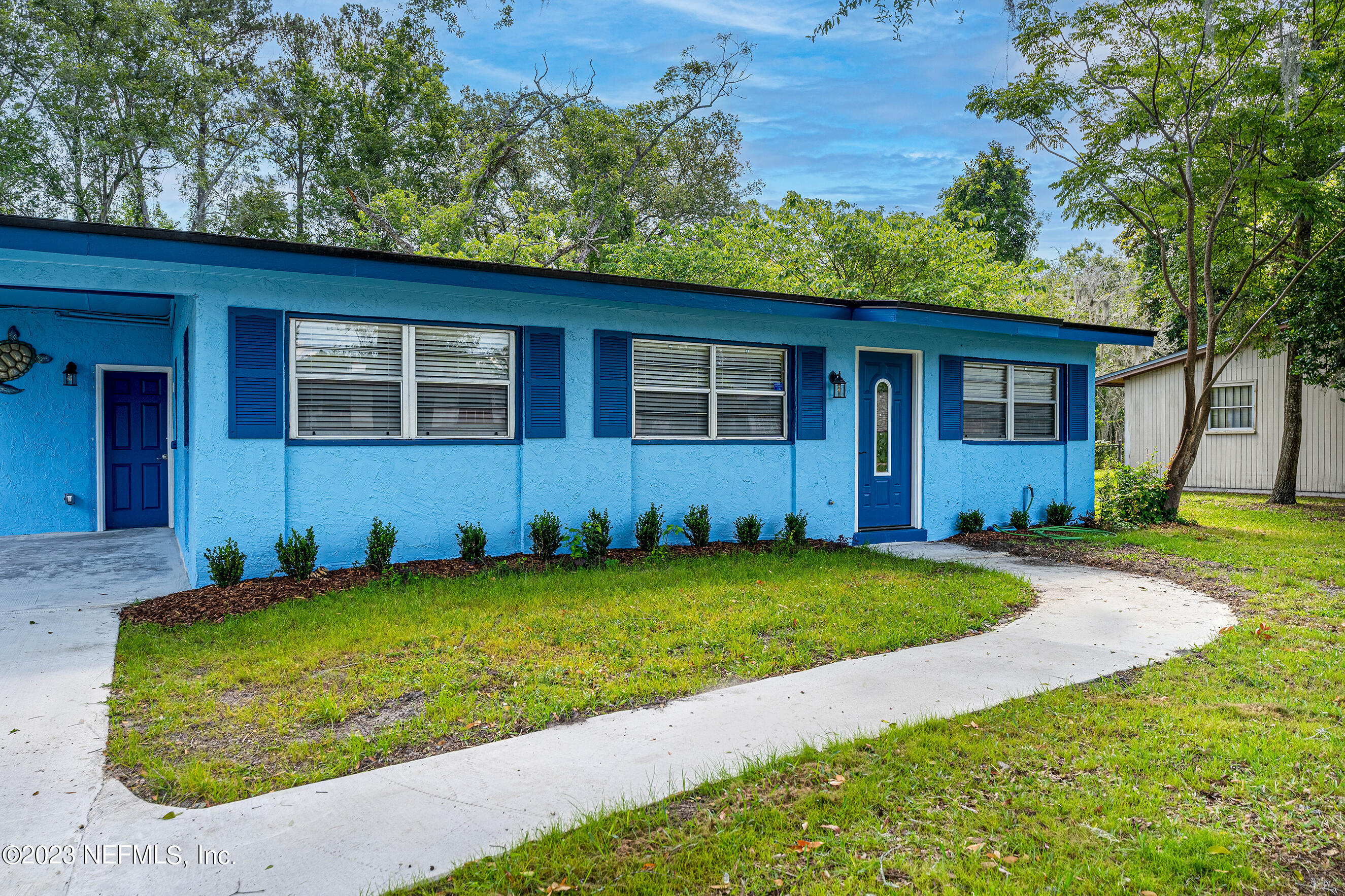 939 Westgate Drive Jacksonville, FL 32221 - Photo 25 of 31 a view of a house with a yard