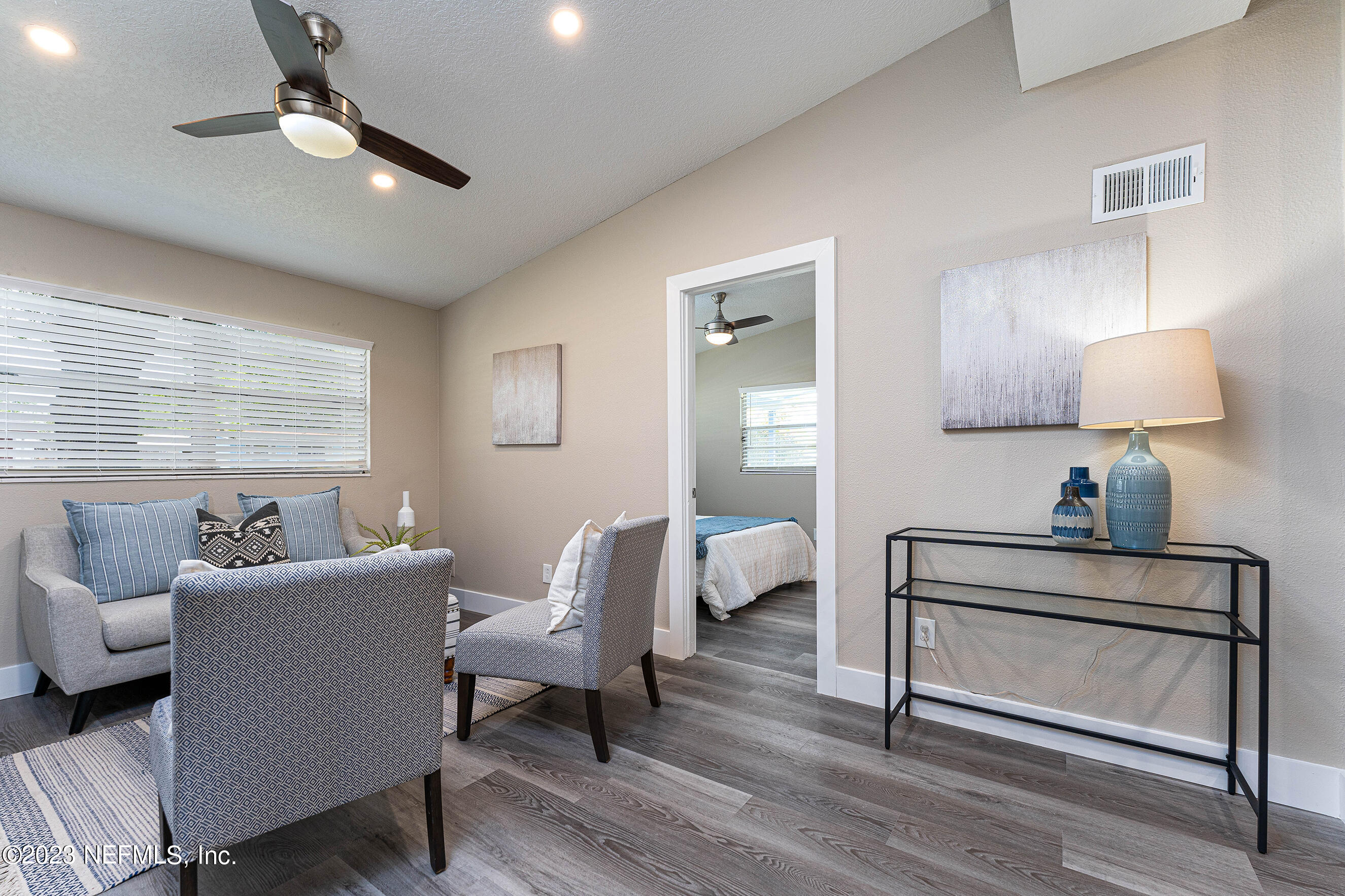 939 Westgate Drive Jacksonville, FL 32221 - Photo 3 of 31 a living room with furniture and a wooden floor