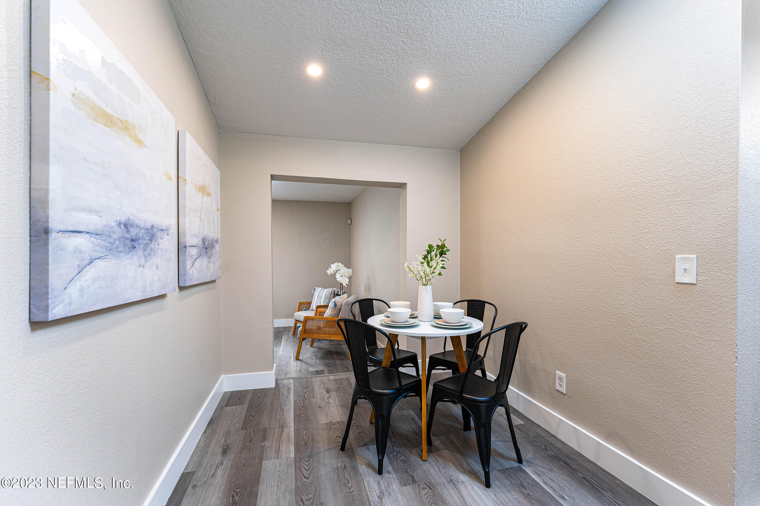 939 Westgate Drive Jacksonville, FL 32221 - Photo 4 of 31 a view of a dining room with furniture and wooden floor