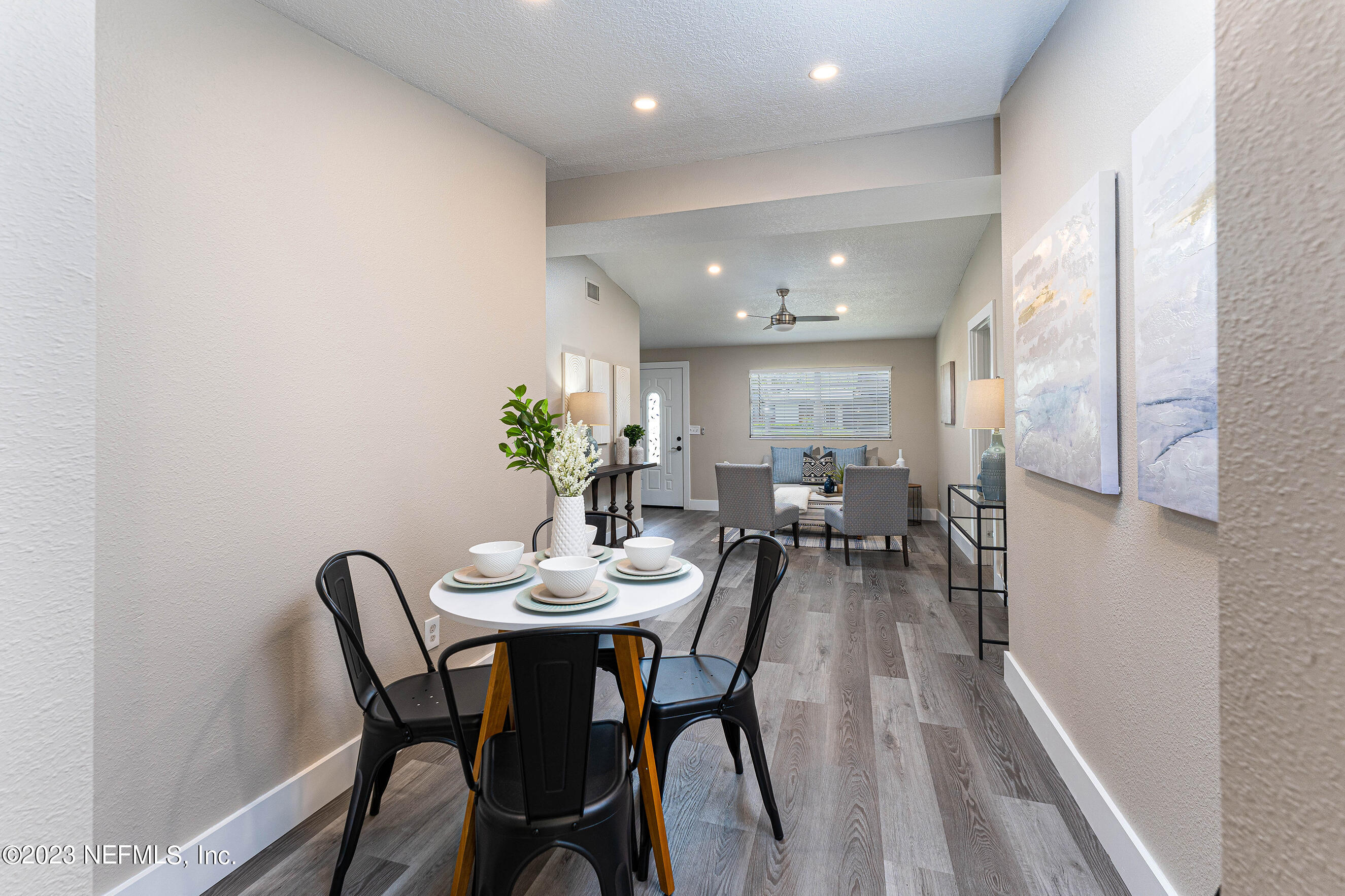 939 Westgate Drive Jacksonville, FL 32221 - Photo 5 of 31 a view of a dining room with furniture and a potted plant