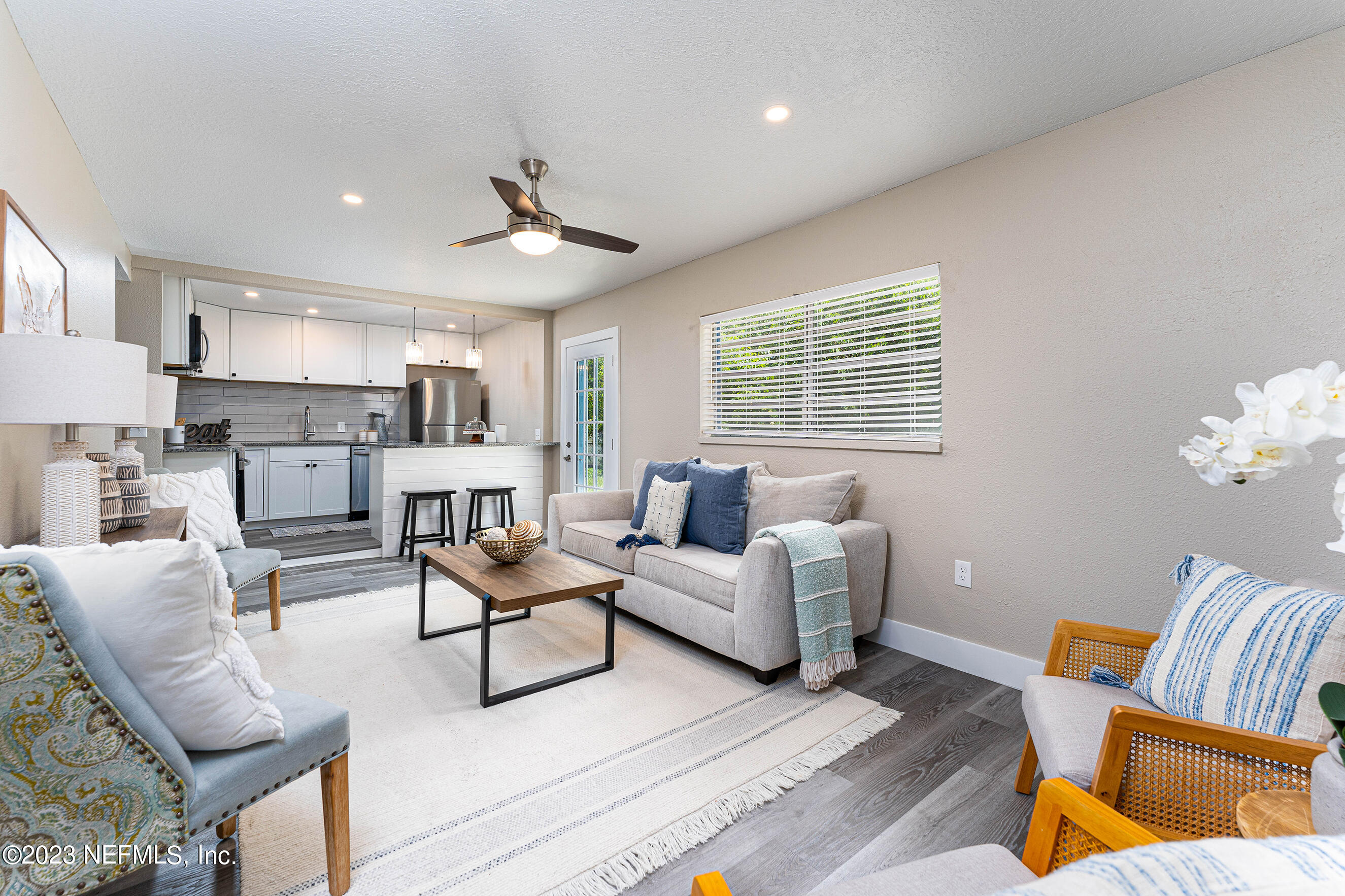 939 Westgate Drive Jacksonville, FL 32221 - Photo 6 of 31 a living room with furniture and a large window