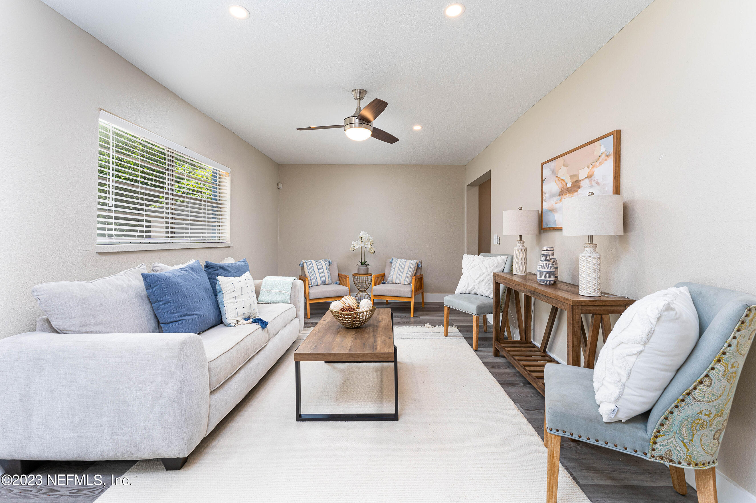 939 Westgate Drive Jacksonville, FL 32221 - Photo 7 of 31 a living room with furniture and a large window