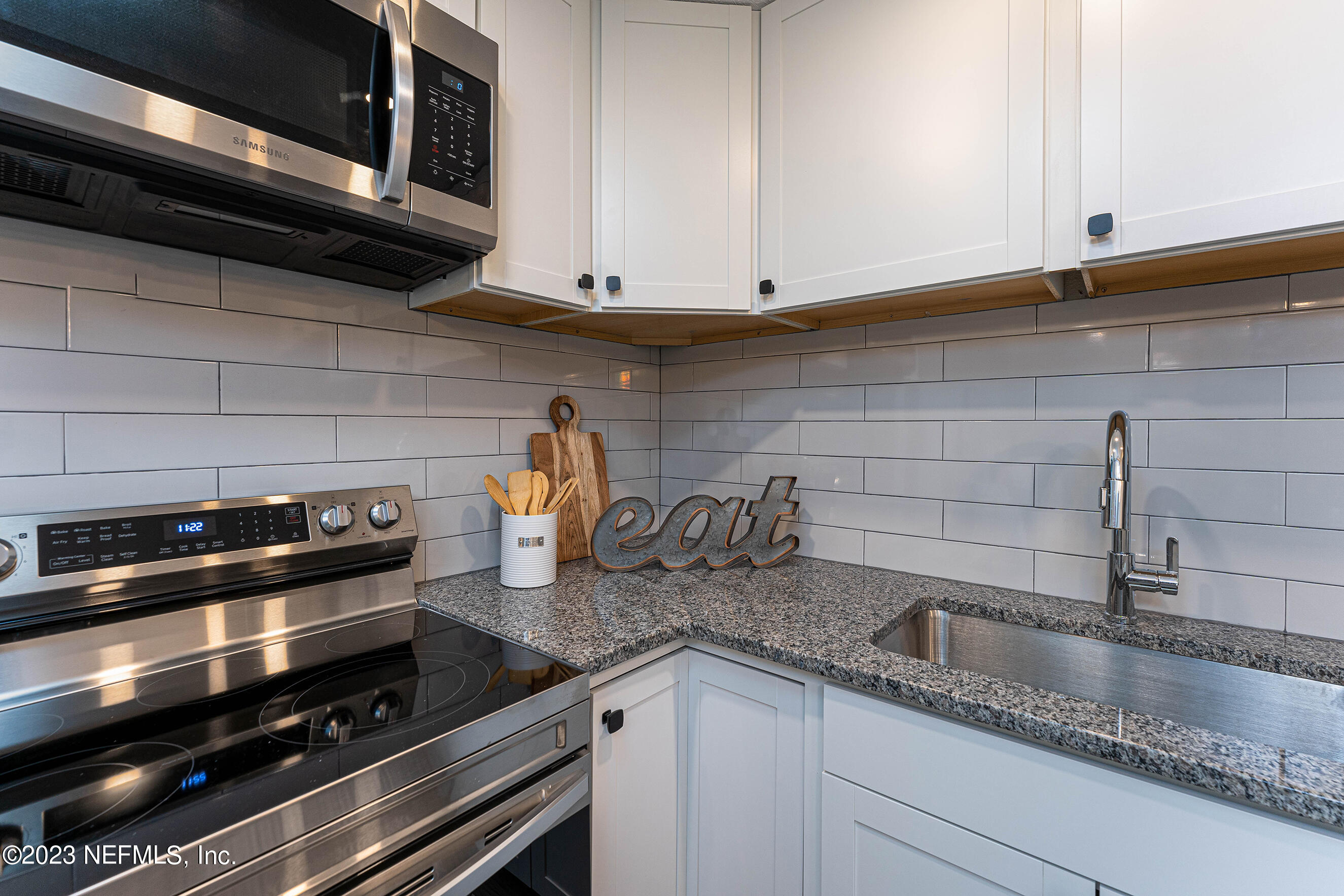 939 Westgate Drive Jacksonville, FL 32221 - Photo 10 of 31 a kitchen with a sink and cabinets